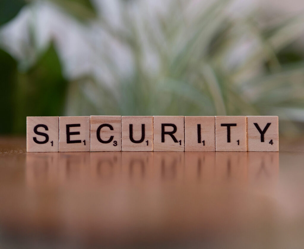 Scrabble tiles spelling out the word security  in a natural setting